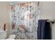 Clean bathroom with a floral shower curtain at 5371 Joyner Ave, Spring Hill, FL 34608