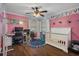 bedroom with crib, desk, and playful decor at 5371 Joyner Ave, Spring Hill, FL 34608