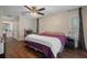 Bright bedroom with a king-size bed and wood flooring at 5371 Joyner Ave, Spring Hill, FL 34608