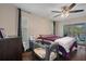 King-size bed, pool view, and a baby crib in this bedroom at 5371 Joyner Ave, Spring Hill, FL 34608