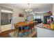 Open concept dining area with a view into the living room and kitchen at 5371 Joyner Ave, Spring Hill, FL 34608