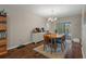 Bright dining room featuring a wooden table, chairs, and access to the pool at 5371 Joyner Ave, Spring Hill, FL 34608