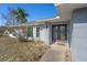 Front entrance with double doors and walkway at 5371 Joyner Ave, Spring Hill, FL 34608