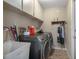Laundry room with washer, dryer, and storage cabinets at 5371 Joyner Ave, Spring Hill, FL 34608