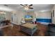 Open living room, dining area, and kitchen with hardwood floors at 5371 Joyner Ave, Spring Hill, FL 34608