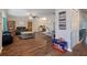Gathering-friendly living room with dark hardwood floors at 5371 Joyner Ave, Spring Hill, FL 34608