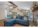 Spacious living room features a comfortable sectional sofa and a stone fireplace at 5371 Joyner Ave, Spring Hill, FL 34608