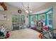 Fun playroom with colorful toys and a view of the backyard at 5371 Joyner Ave, Spring Hill, FL 34608