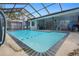 Inviting screened pool with tiled deck at 5371 Joyner Ave, Spring Hill, FL 34608