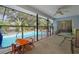 Screened pool area with patio furniture at 5371 Joyner Ave, Spring Hill, FL 34608