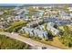 Aerial view of community, pool, and waterway access at 5557 Sea Forest Dr # 117, New Port Richey, FL 34652