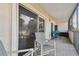 Private screened balcony with seating at 5557 Sea Forest Dr # 117, New Port Richey, FL 34652