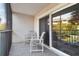 Screened balcony with patio furniture at 5557 Sea Forest Dr # 117, New Port Richey, FL 34652