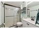 Bathroom with a walk-in shower and updated vanity at 5557 Sea Forest Dr # 117, New Port Richey, FL 34652