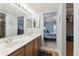 Double vanity bathroom with view into bedroom at 5557 Sea Forest Dr # 117, New Port Richey, FL 34652