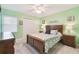Bright bedroom with a double bed and wooden furniture at 5557 Sea Forest Dr # 117, New Port Richey, FL 34652