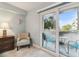 Bedroom with private balcony access and comfortable seating at 5557 Sea Forest Dr # 117, New Port Richey, FL 34652