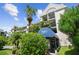 Heather Cove I building, featuring a blue awning at 5557 Sea Forest Dr # 117, New Port Richey, FL 34652