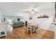 Open concept dining area with a table and chairs at 5557 Sea Forest Dr # 117, New Port Richey, FL 34652