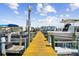 Community boat dock with several boats at 5557 Sea Forest Dr # 117, New Port Richey, FL 34652