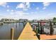 Long wooden dock with boats and water views at 5557 Sea Forest Dr # 117, New Port Richey, FL 34652