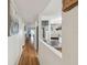 Hallway with hardwood floors and a view of the living room at 5557 Sea Forest Dr # 117, New Port Richey, FL 34652
