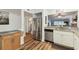Kitchen with stainless steel appliances and a view of the living area at 5557 Sea Forest Dr # 117, New Port Richey, FL 34652