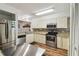 Well-equipped kitchen with stainless steel appliances and granite countertops at 5557 Sea Forest Dr # 117, New Port Richey, FL 34652