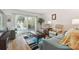 Living room with two armchairs and sliding doors to balcony at 5557 Sea Forest Dr # 117, New Port Richey, FL 34652