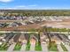 Aerial view showcasing a community of houses with green lawns at 578 Argyll Dr, Spring Hill, FL 34609
