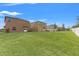 Spacious backyard with a view of the house and a fence at 578 Argyll Dr, Spring Hill, FL 34609