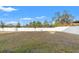 Large backyard with a white fence and patchy grass at 578 Argyll Dr, Spring Hill, FL 34609