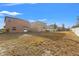 Spacious backyard with a view of the house and a fence at 578 Argyll Dr, Spring Hill, FL 34609
