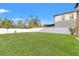 Large backyard with a white fence and green grass at 578 Argyll Dr, Spring Hill, FL 34609
