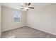 Spacious bedroom featuring a ceiling fan and window at 578 Argyll Dr, Spring Hill, FL 34609