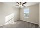 Well-lit bedroom with ceiling fan and window at 578 Argyll Dr, Spring Hill, FL 34609