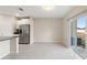 Kitchen and dining area with tile floors and sliding glass doors at 578 Argyll Dr, Spring Hill, FL 34609