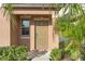 Inviting front door entrance with landscaping and a small porch at 578 Argyll Dr, Spring Hill, FL 34609