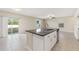 Kitchen island with granite countertop and double sink at 578 Argyll Dr, Spring Hill, FL 34609