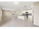 Modern kitchen with white cabinets, granite countertops, and island at 578 Argyll Dr, Spring Hill, FL 34609