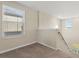 Bright loft space featuring large windows and neutral wall colors at 578 Argyll Dr, Spring Hill, FL 34609