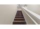 Carpeted staircase leading to the second floor at 578 Argyll Dr, Spring Hill, FL 34609