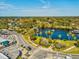 Aerial view of a town park with a pond and palm trees at 5933 Lafayette St, New Port Richey, FL 34652