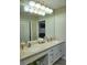 Double vanity bathroom with updated countertops and tile flooring at 6801 Dali Ave # G104, Land O Lakes, FL 34637