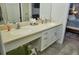 Double vanity bathroom with updated countertops and tile flooring at 6801 Dali Ave # G104, Land O Lakes, FL 34637