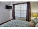 Bedroom with wooden bed frame and ocean-themed bedding at 6801 Dali Ave # G104, Land O Lakes, FL 34637