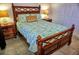 Bedroom with wooden bed frame and ocean-themed bedding at 6801 Dali Ave # G104, Land O Lakes, FL 34637