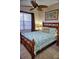 Bedroom with wooden bed frame and ocean-themed bedding at 6801 Dali Ave # G104, Land O Lakes, FL 34637