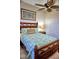 Bedroom with wooden bed frame and ocean-themed bedding at 6801 Dali Ave # G104, Land O Lakes, FL 34637