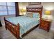 Bedroom with wooden bed frame and ocean-themed bedding at 6801 Dali Ave # G104, Land O Lakes, FL 34637